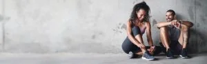 couple-fitness-happy-by-banner-break-active-health-wellness-positive-people-smile-exercise-by-training-gym-space-gray-background-performance-cardio-workout-wall